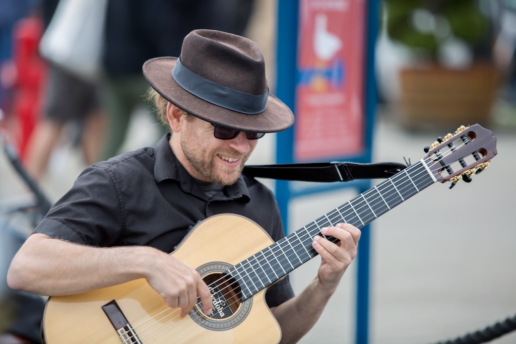 John Clarke performing guitar music at Pier 39 San Francisco